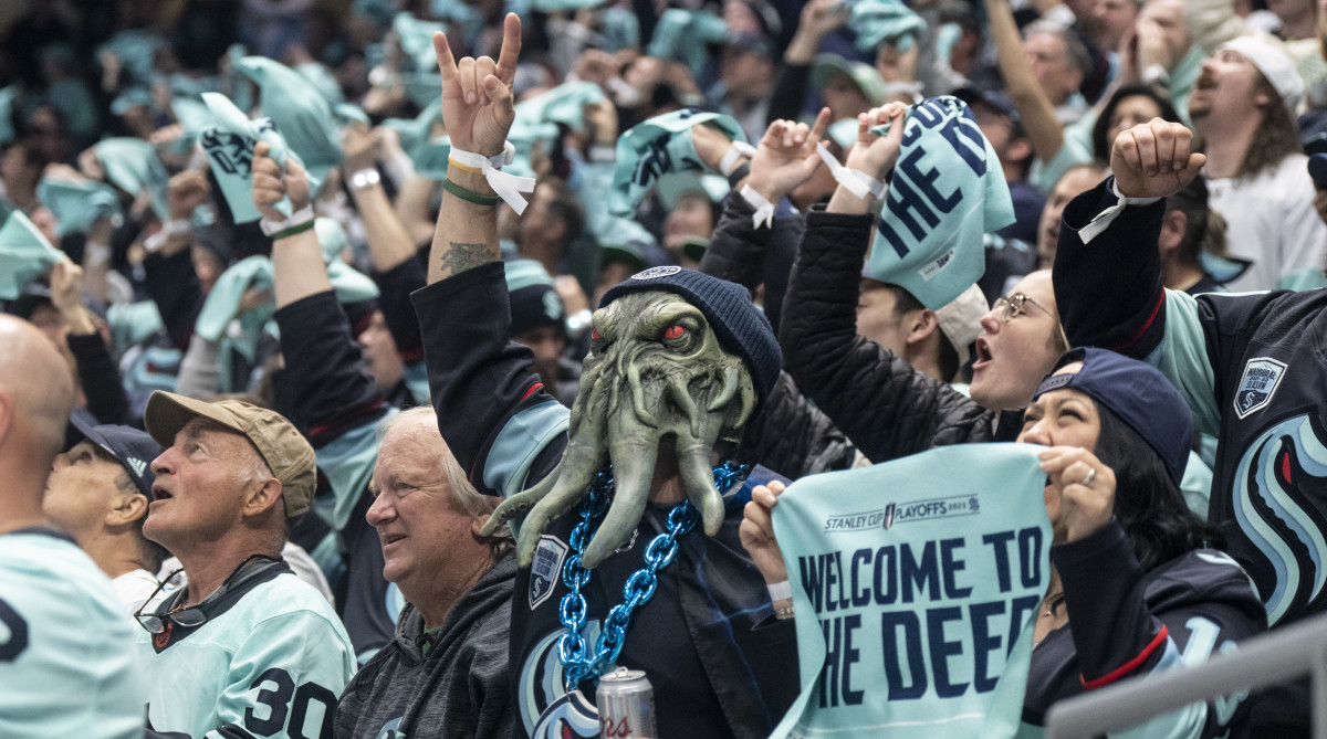 Fans celebrate a Seattle Kraken goal during game three of the second round of the 2023 Stanley Cup Playoffs.